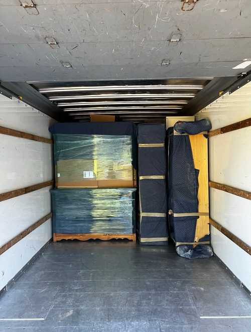 Protected household items loaded inside a moving truck